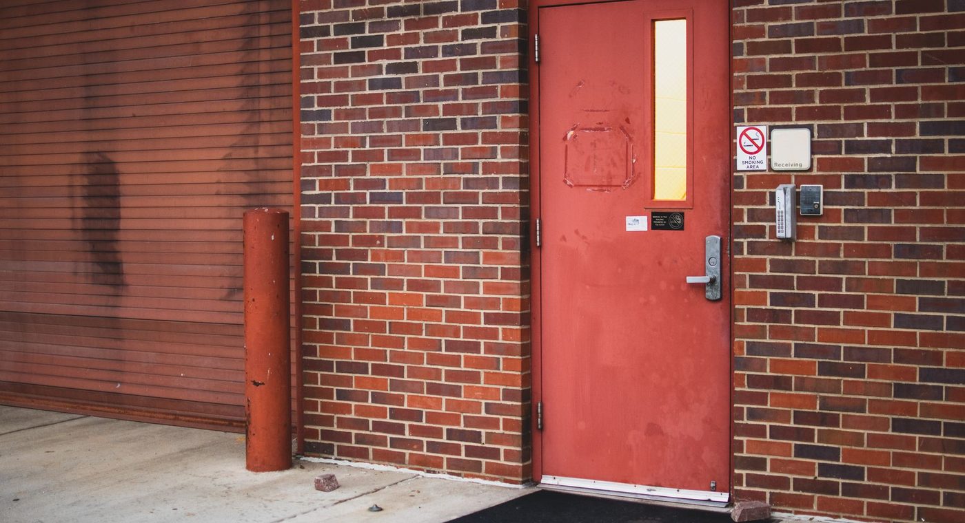 A steel security door installed over a home's front entrance
